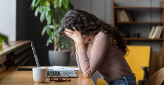 bigstock-Exhausted-Upset-Woman-Sit-At-D-444121277